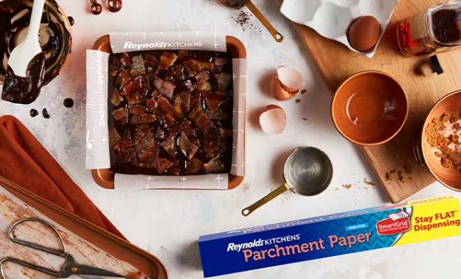 Bacon Bourbon Brownies in a square parchment lined pan