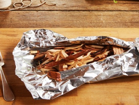 Wood chips inside open faced packet made of foil.