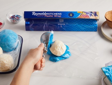 Placing a scoop of blue ice cream