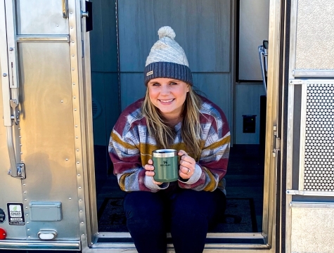 Chief Grillderness Officer winner, Kirsty Fout, sitting outside of her camper