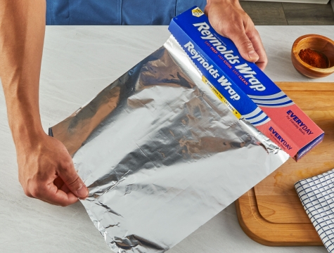 Foil being dispensed from package