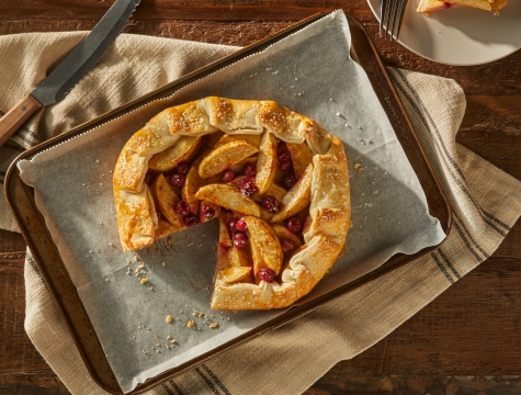 tart on parchment paper inside a baking sheet