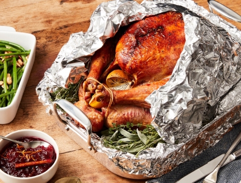 A turkey wrapped in foil, perfectly cooked for Thanksgiving