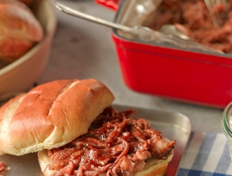 Pulled pork sitting on a brioche bun