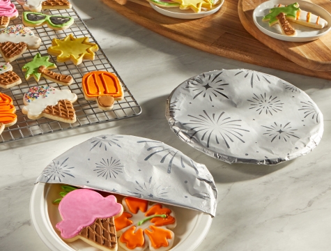 Summer themed sugar cookies on a plate covered with Reynolds Wrap Festive Fun Foil