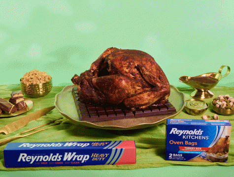 Turkey sitting alongside a box of Reynolds Wrap Heavy Duty Foil and Reynolds Kitchens Oven Bags