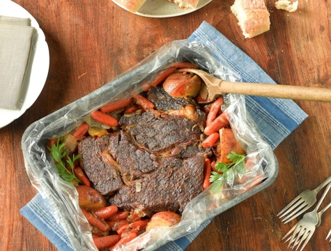 pot roast sitting in an oven bag on a kitchen table