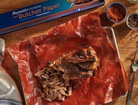 pork butt sitting on a sheet of Reynolds Kitchens butcher paper
