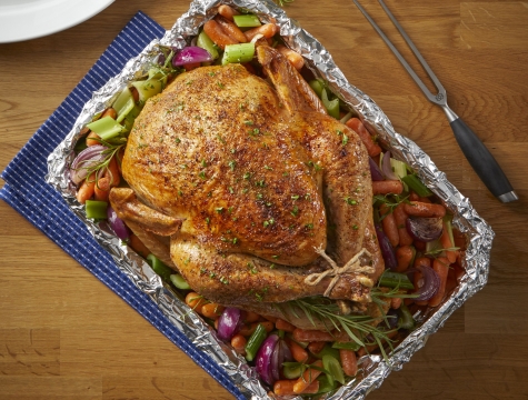chicken in a foil lined roasting pan