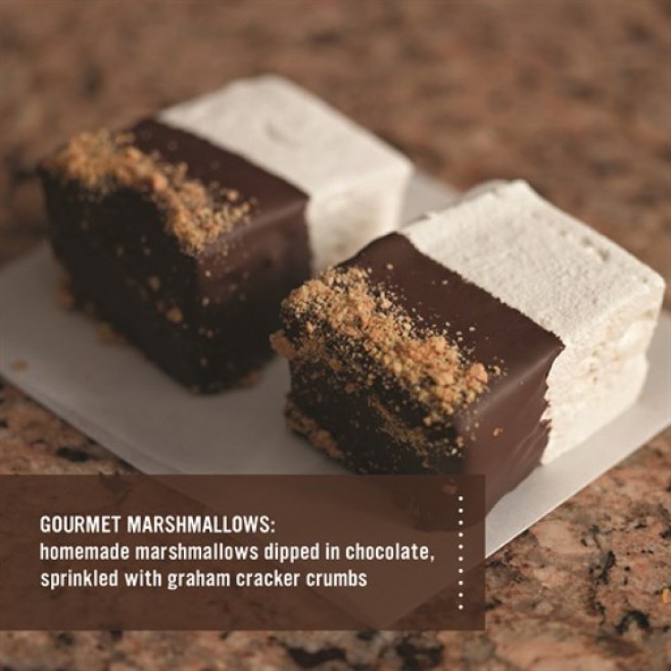 Homemade marshmallows dipped in chocolate, sprinkled with graham cracker crumbs.