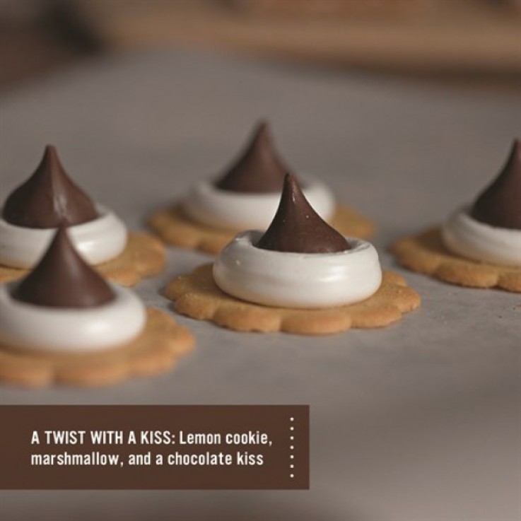 Smores made out of lemon cookie, marshmallow and chocolate kiss.