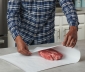 Man wrapping meat in freezer paper
