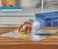 Chicken gyro wrapped in aluminum foil and sitting on a kitchen counter