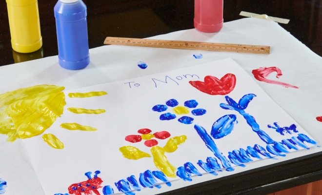 Kids painting on freezer paper