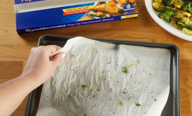 Pop upsheets on a table with two hands