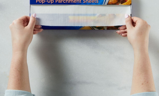 A person unrolling Pop upsheets