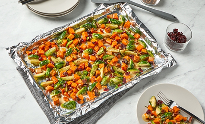 
Roasted Sweet Potatoes and Brussels Sprouts with Cranberries and Pecans
