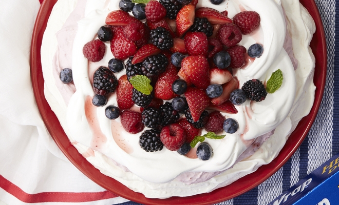 
Foil-Packet Pavlova with Raspberry-Lemon Mascarpone, Whipped Cream &amp; Berries
