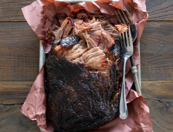 smoked pork butt on a sheet of butcher paper