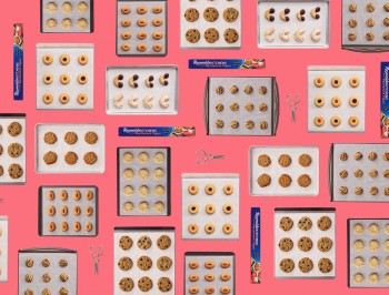 multiple baking trays with cookies