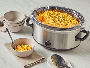 mac and cheese in a slow cooker lined with a Reynolds Kitchens slow cooker liner